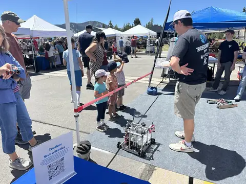 Kids stop to see our robot at the Truckee Maker Show.