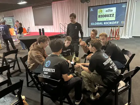 Team members at the BIOBUZZ Global Kickoff, where the 2026–27 FTC game was revealed.